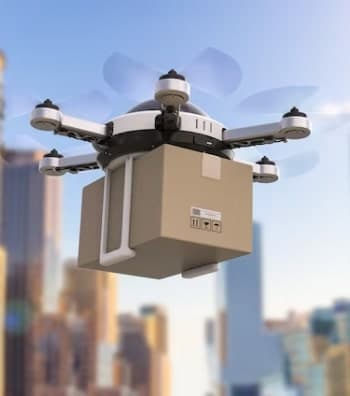 Delivery drone carrying a parcel over a city